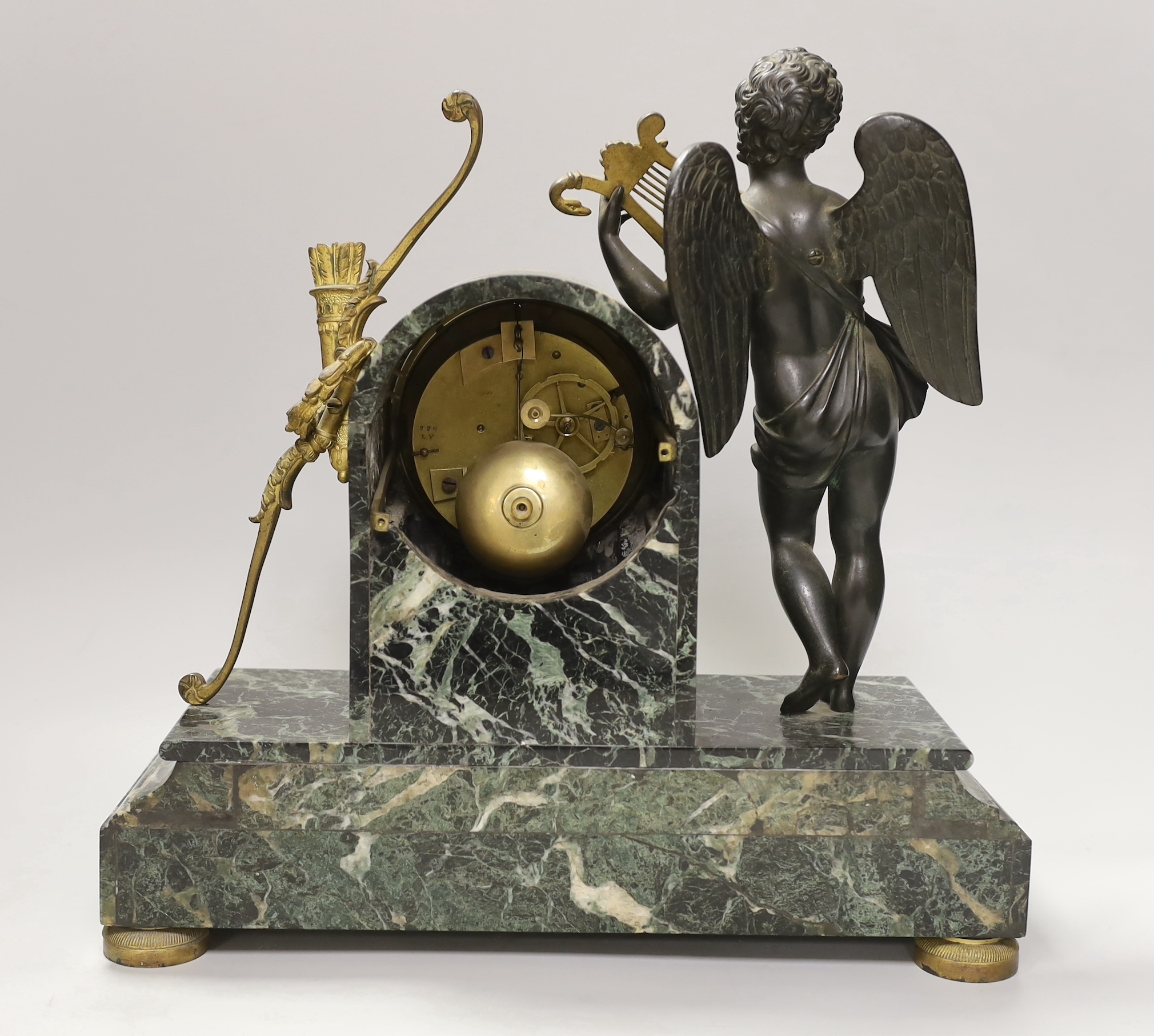 An early 19th century French ormolu and marble mantel clock in the form of Apollo, the enamel dial inscribed, Gigault A Nantes, 35cm high